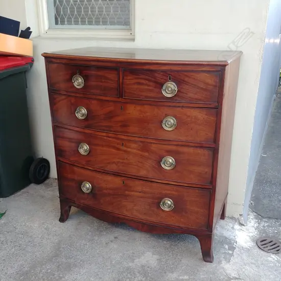 A good Georgian mahogany bowfront chest of five drawers