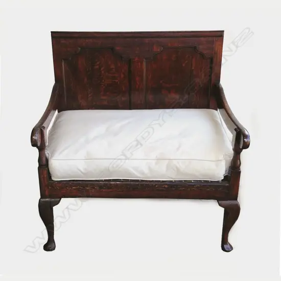 A Georgian oak settle of unusual small proportions