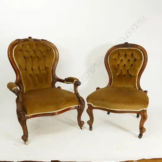A pair of Victorian mahogany grandfather and grandmother chairs