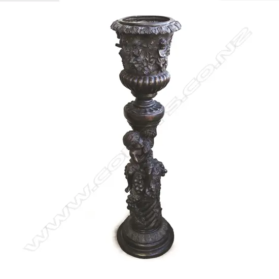 A tall bronze planter of classical campana shape