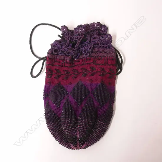 A vintage woven and beaded purse