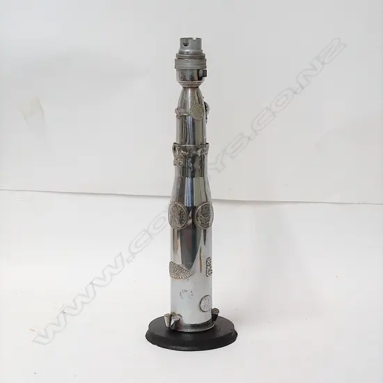 A WWII Trench Art projectile lamp base