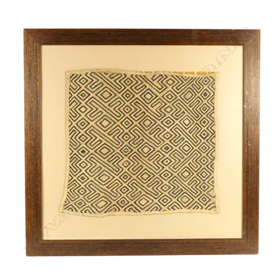 A vintage framed Congolese Kuba cloth