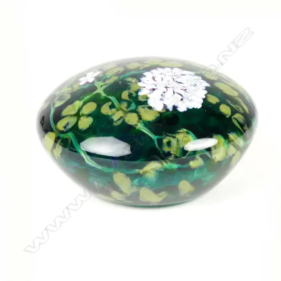 A Peter Raos glass paperweight