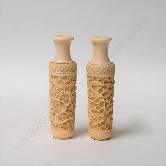 A pair of old Chinese carved ivory small urns