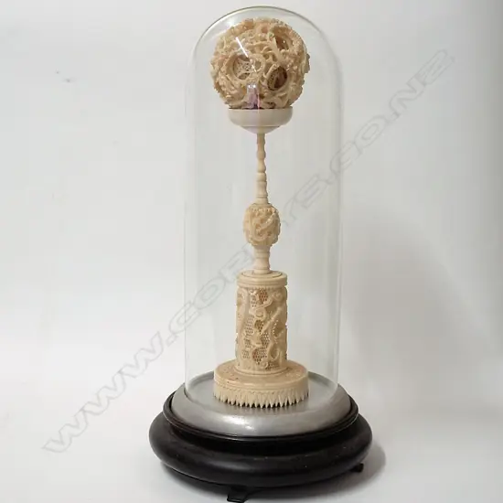 An old large Chinese carved ivory puzzle ball on stand