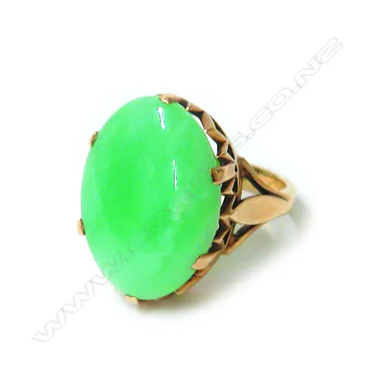 A vintage 9ct. substantial yellow gold and jadeite panel dress ring