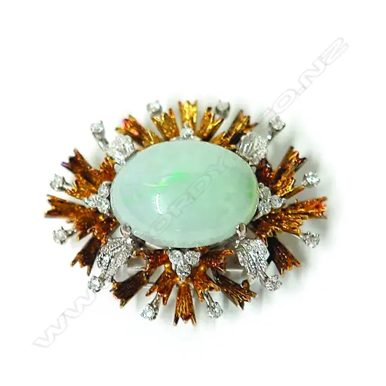 A stylish 1970s 18ct. yellow and white gold diamond and jade brooch