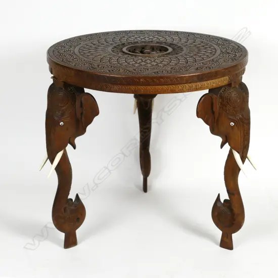 An Indian carved occasional table
