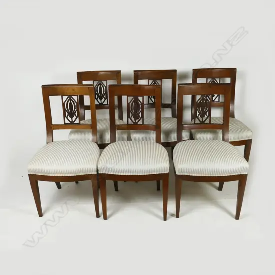 A set of six 19thC French walnut bar-back dining chairs with pineapple carved and pierced splats