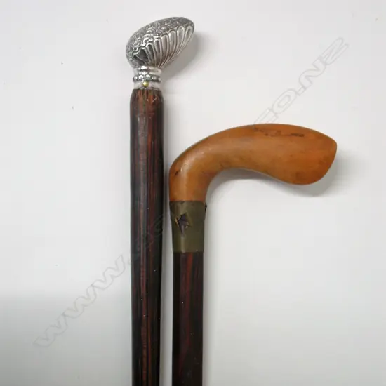 Two rosewood shafted walking sticks