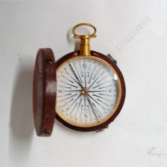 An early 19thC gilded metal framed pocket compass