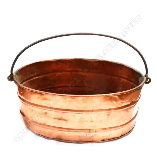 An old copper wine cooler