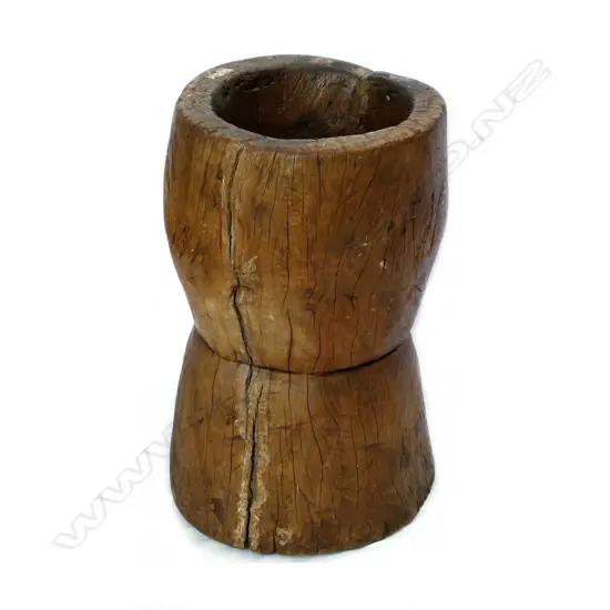 A large wooden grain pounding pot