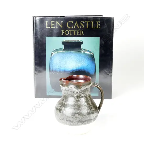 A Len Castle baluster jug with grey glazed effects. Impressed mark. H.150. Together with the book 'Len Castle