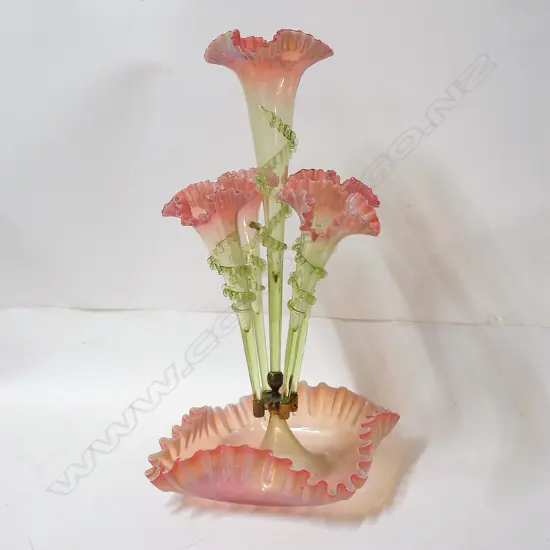 A Victorian pale cranberry and vaseline glass five trumpet epergne