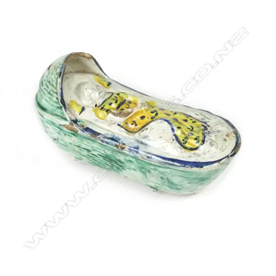 An early 19thC Prattware 'Baby in Crib' figure