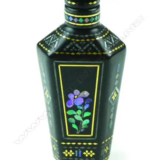 A small papier-mâché snuff bottle