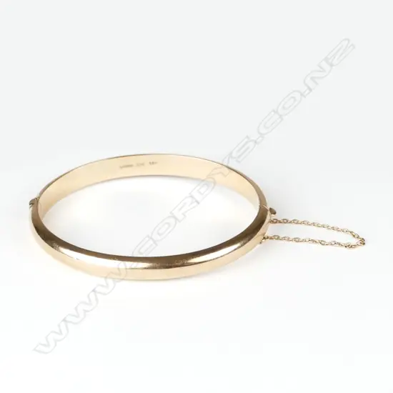 A lady's half-hinged 9ct. rose gold bangle