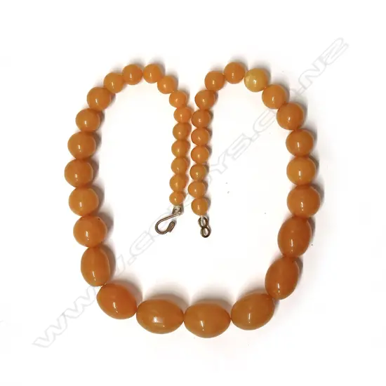 A vintage butterscotch amber tapered bead necklace