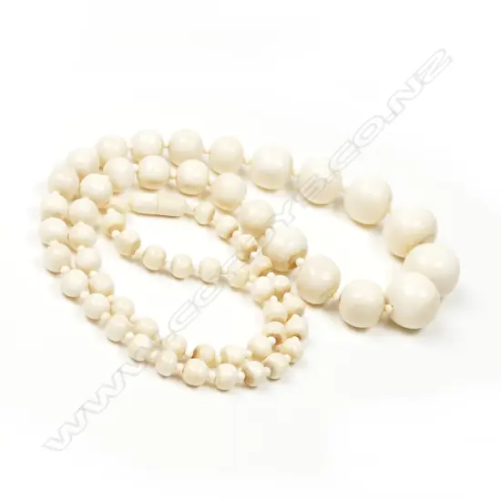 A vintage ivory bead necklace