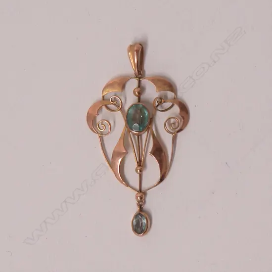 An Art Nouveau 9ct. rose gold and topaz set pendant