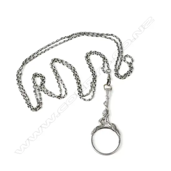 An Arts & Crafts mounted magnifying glass on silver fob chain