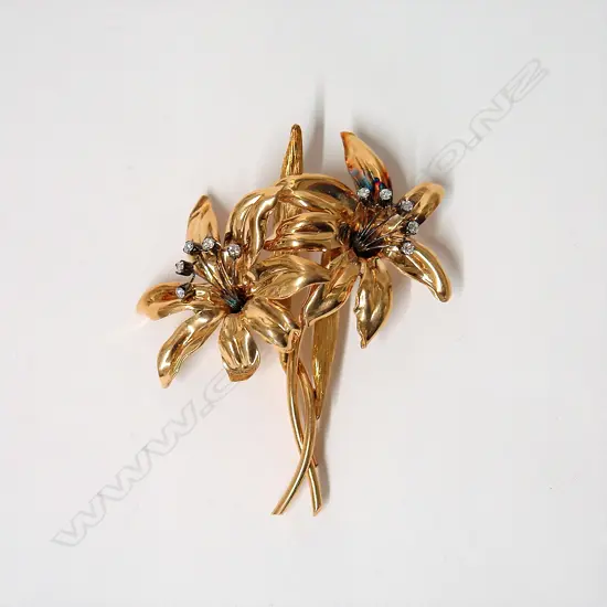 A vintage large 18ct. yellow gold and diamond floral brooch