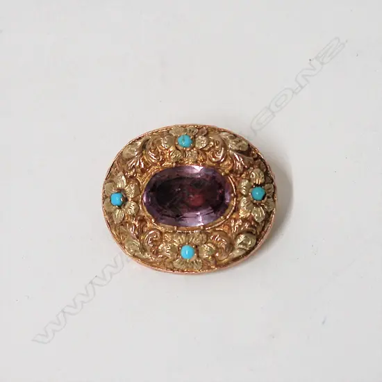 A 19thC 9ct. yellow gold amethyst and turquoise decorative brooch