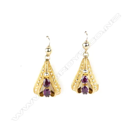 A pair of late 19thC gold and amethyst elegant drop earrings