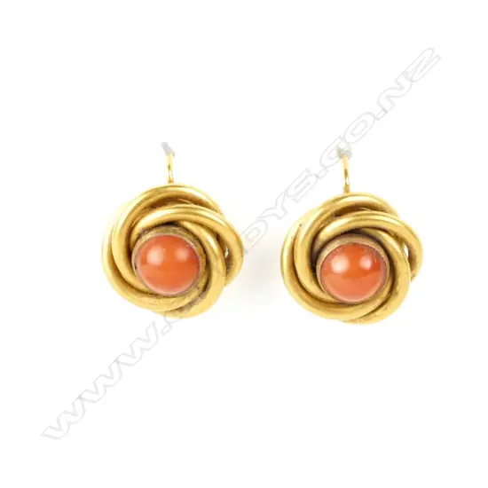 A pair of 15ct. yellow gold and coral knot form earrings