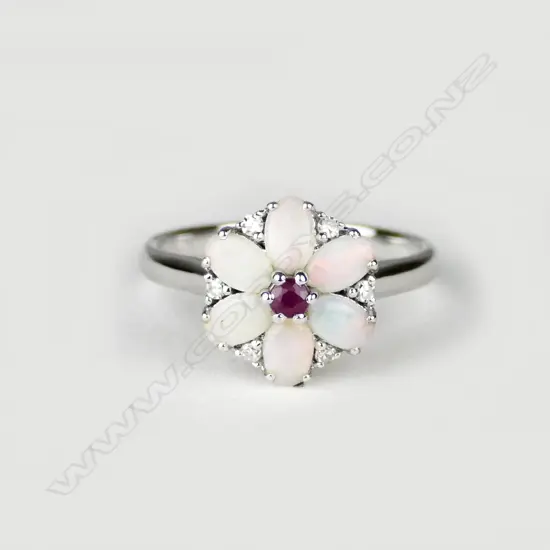 An 18ct. white gold opal ruby and diamond ring