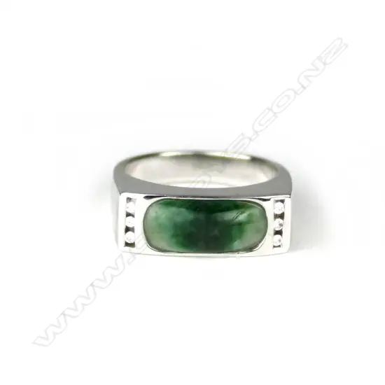 An 18ct. white gold jade and diamond modern dress ring