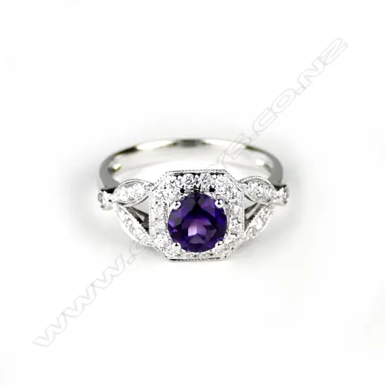 An 18ct. white gold amethyst and diamond dress ring