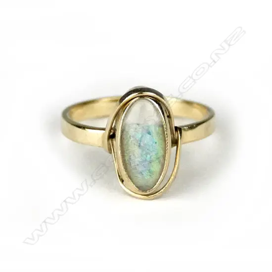 A 1920s 9ct. yellow gold and opal dress ring