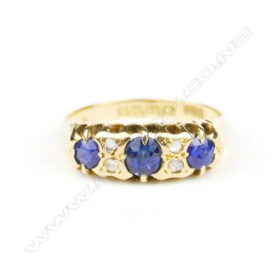 An English made 1919 lady's 18ct. yellow gold sapphire and diamond London bridge style ring