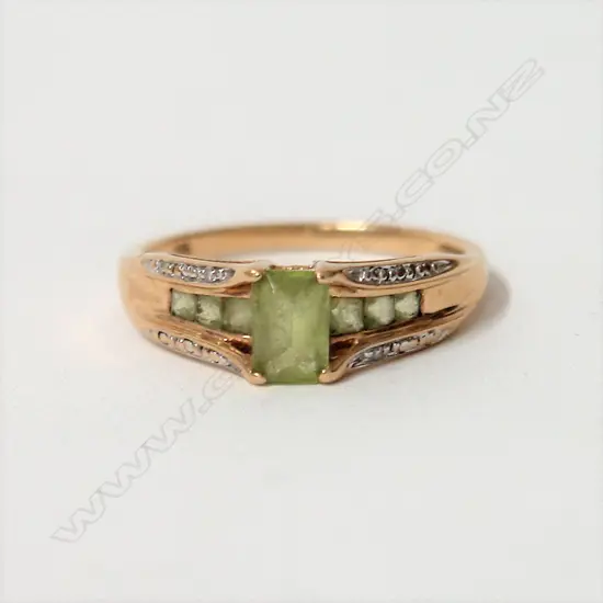 A vintage 9ct. peridot and diamond dress ring
