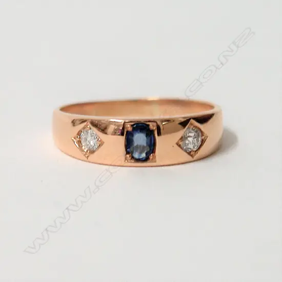 An 18ct. yellow gold sapphire and diamond gypsy style ring