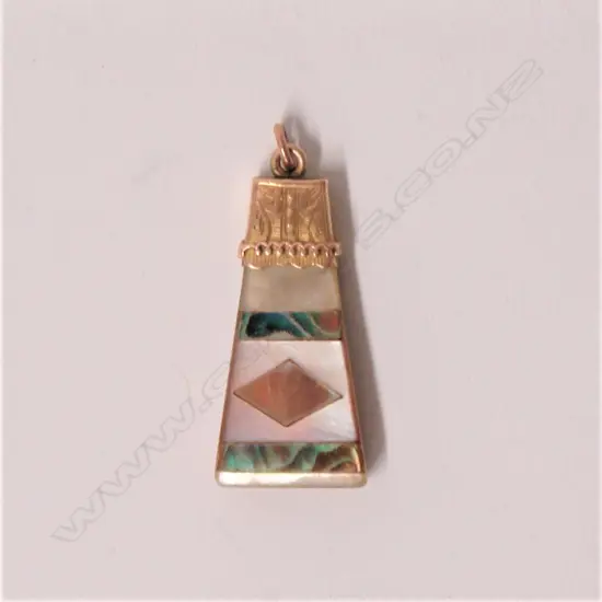 A late 19thC colonial gold and abalone mounted mother-of-pearl pendant