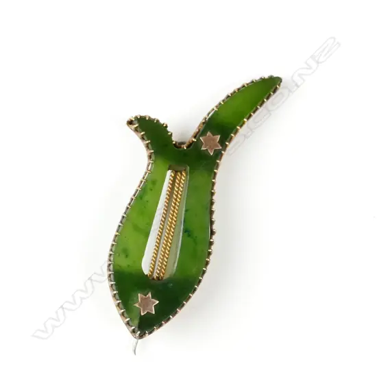 An early 20thC 9ct. yellow gold and nephrite lyre form brooch