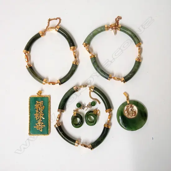Six Chinese jade and gilt metal fitted jewellery items