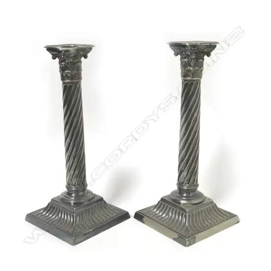 A pair of Victorian silver plate Corinthian column candlesticks