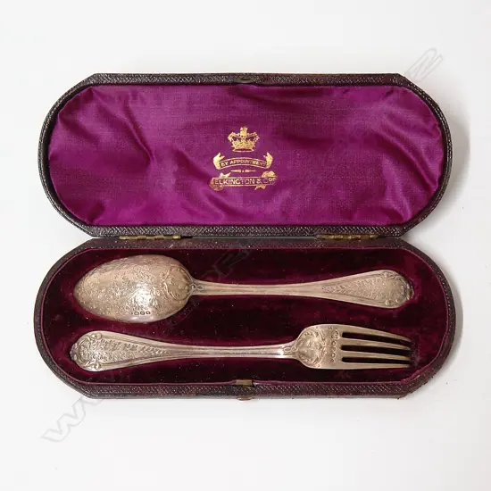 A cased pair of a Victorian silver christening spoon and fork set