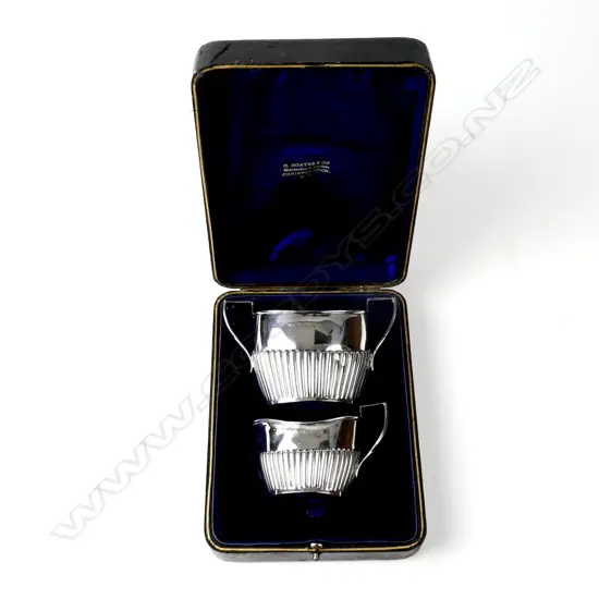 A boxed set of late Victorian silver cream and sugar