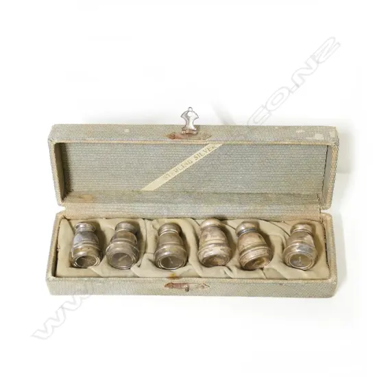 A cased set of six silver miniature salt shakers