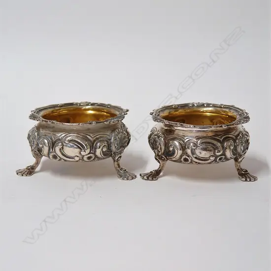 A pair of decorative silver salts