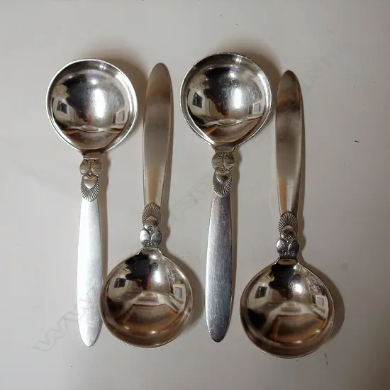 A set of four 20thC Georg Jensen silver cactus pattern serving spoons