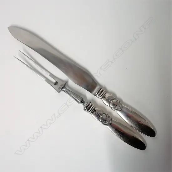 A 20thC Georg Jensen cactus silver handled two-piece carving set