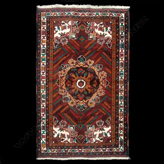 A hand knotted Baluchi rug