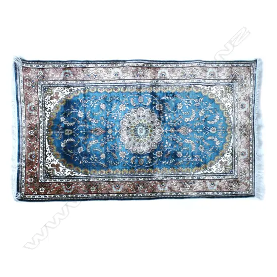 A small fine quality hand-knotted silk rug